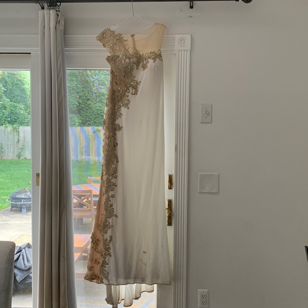 Jovani Dress. size 10. dirty at bottom. Has bustle.